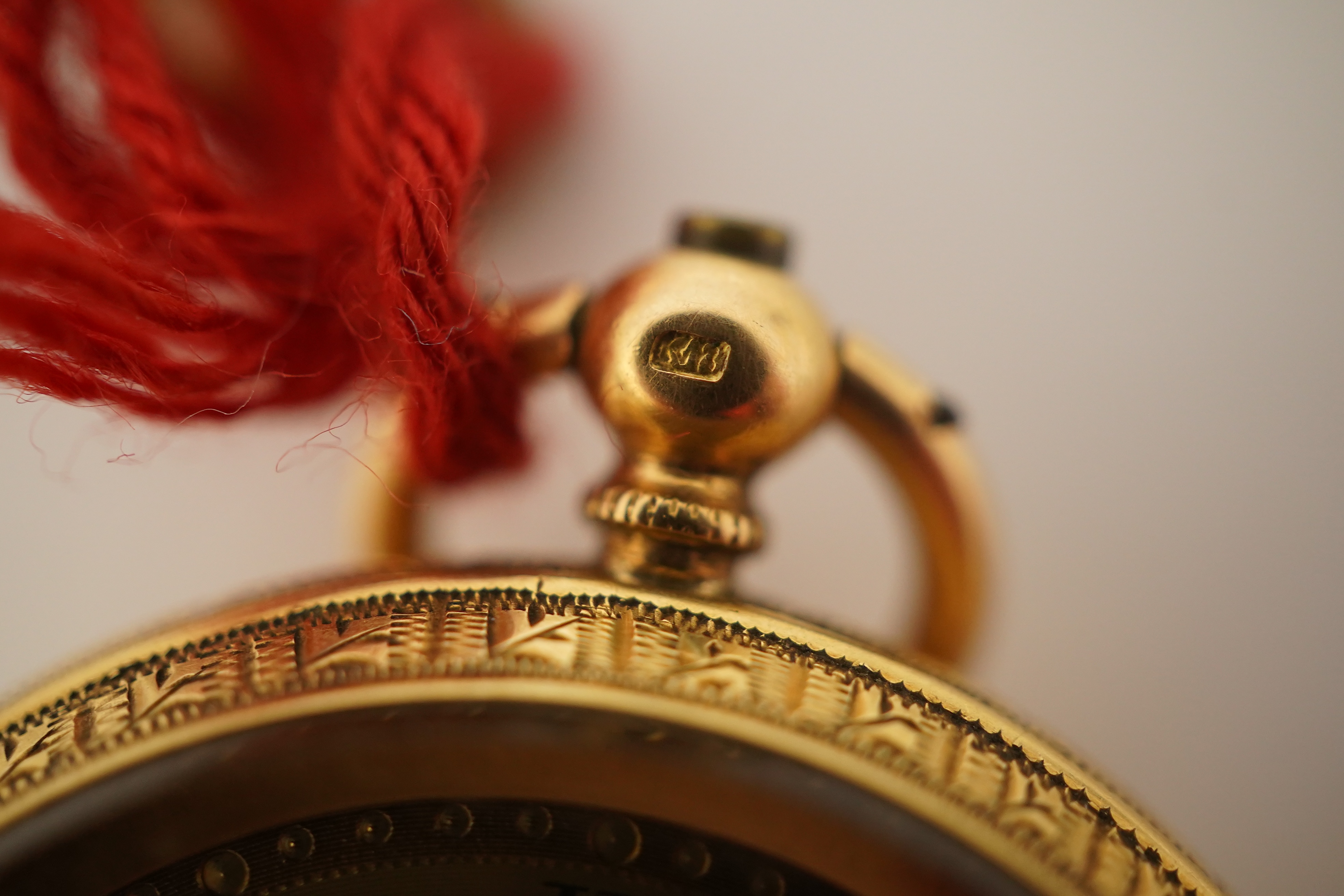 An early 20th century continental engraved 18k gold open faced fob watch